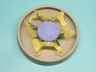 Three Ti-Light patterns mounted on waxdisk for Cast by Ti-Research